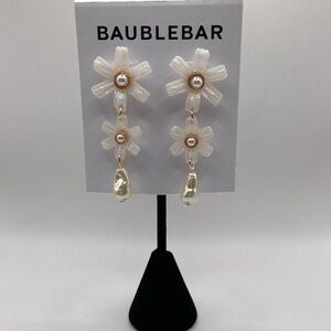 BaubleBar flower earrings.
